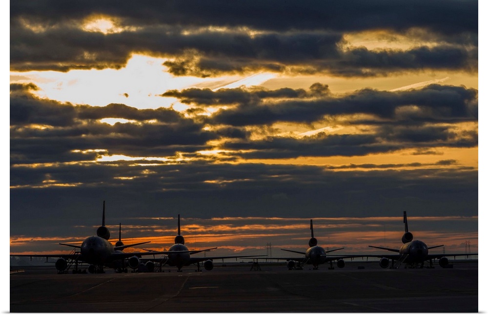 KC-10 Extenders of the U.S. Air Force sit on the ramp at Travis Air Force Base, California, at sunrise.