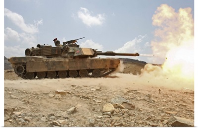 Marines bombard through a live fire range using M1A1 Abrams tanks