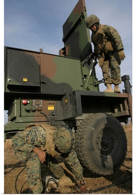 Marines prepare the antenna of an AN/TPQ 46A radar system