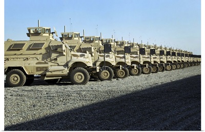 Mine Resistant Ambush Protected vehicles sit at Camp Liberty