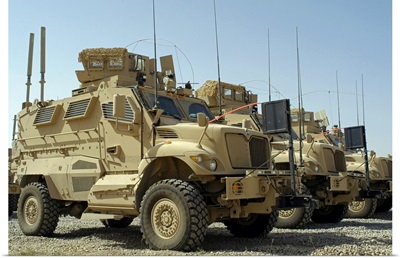 Mine Resistant Ambush Protected vehicles sit in parking area at Joint Base Balad Iraq