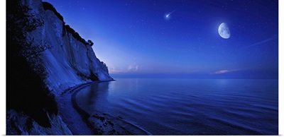 Moon rising over tranquil sea and Mons Klint cliffs, Denmark