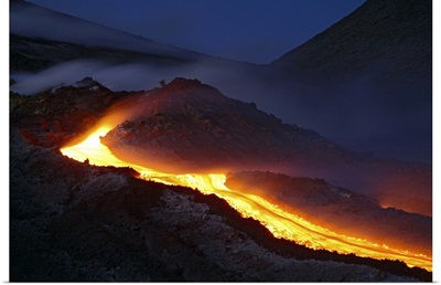 Mount Etna lava flow at night Sicily Italy