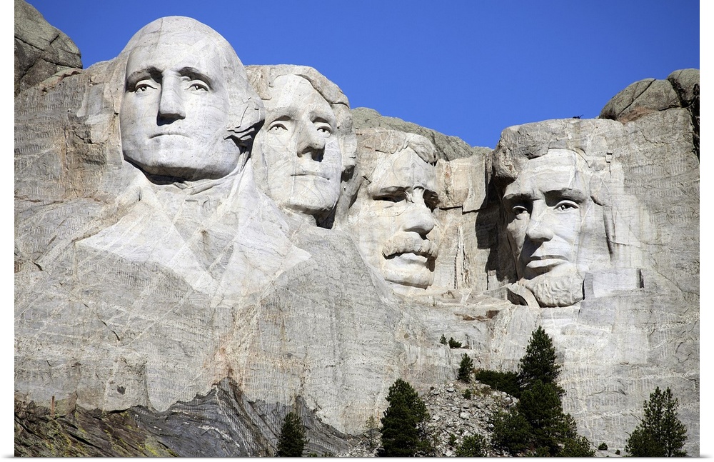 Picture of the four stone heads of past United States Presidents that make up the National Park of Mount Rushmore.