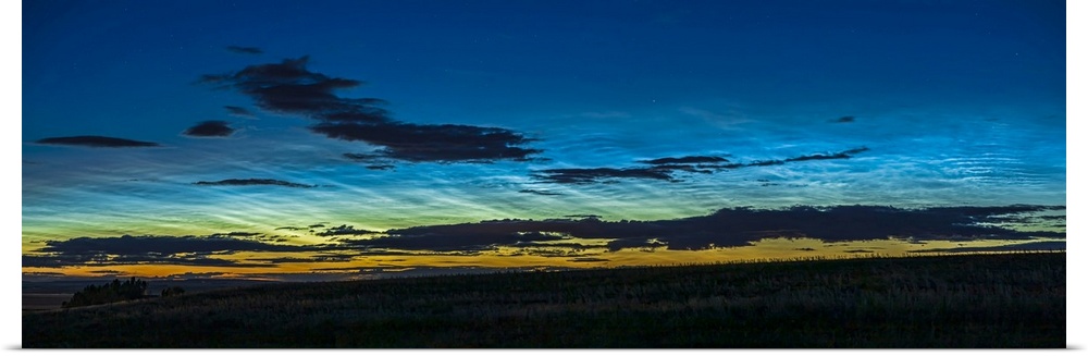 A 45 degree panorama of noctilucent clouds seen the night of June 1-2, 2020 in Alberta, Canada, first at dusk and then lat...