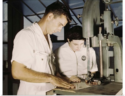 NYA employees receiving training in the Assembly and Repair Department at Naval Base
