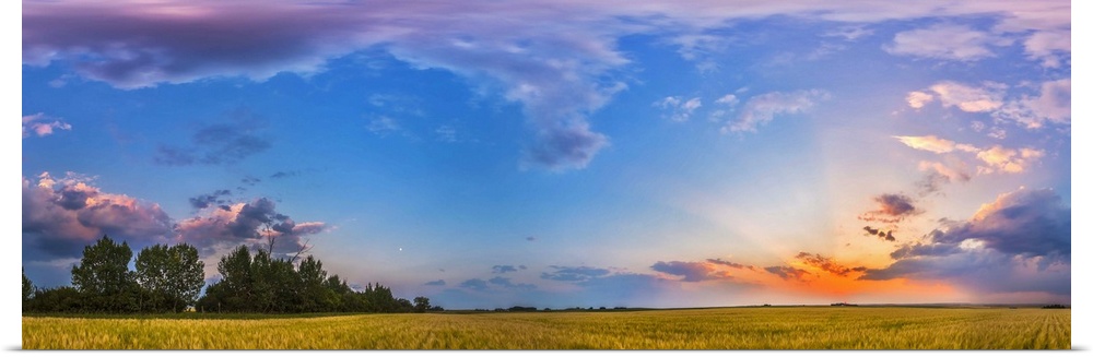 August 6, 2014 - The colors of the sunset sky in a 360 degree panorama at sunset in Alberta, Canada. The setting Sun is at...
