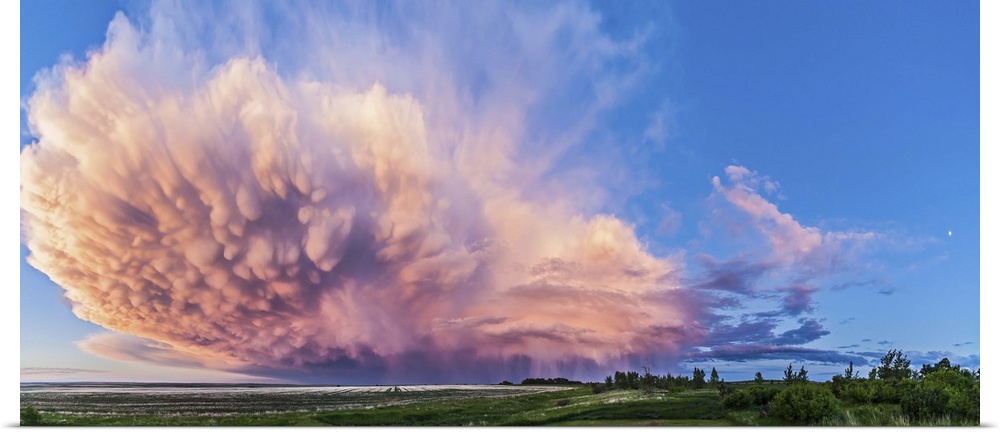 June 17, 2013 - Panoramic view of a retreating thunderstorm in Alberta, Canada. The storm shows mammatocumulus clouds and ...