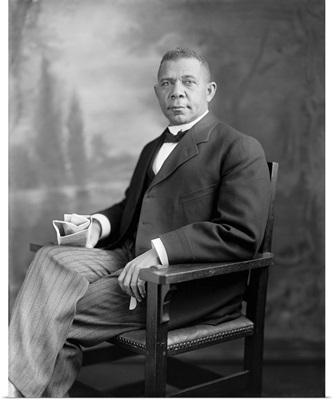 Portrait of Booker T. Washington sitting in a chair