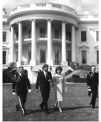 President John F. Kennedy and the First Lady in front of White House