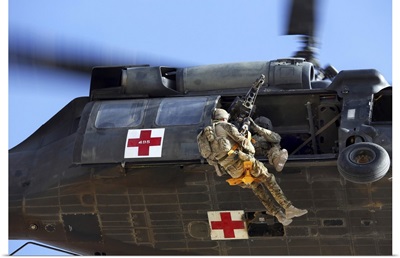 Royal Australian Air Force Aircraftman Is Hoisted Onto A UH-60 Black Hawk