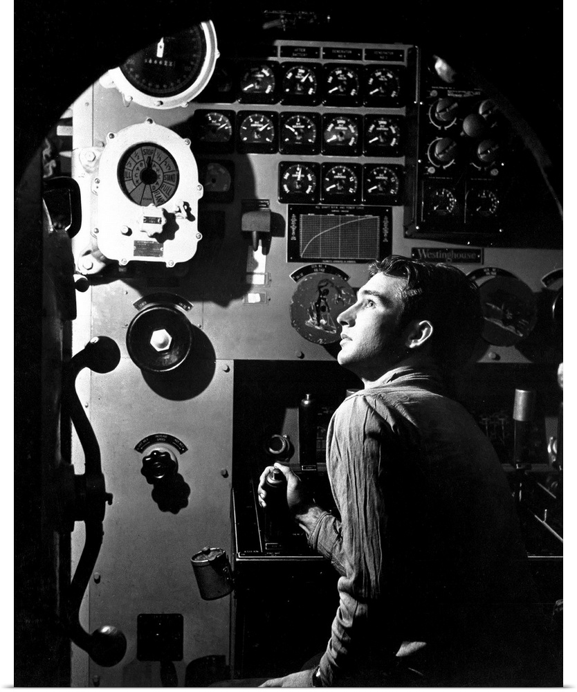 Sailor at work in the electric engine control room of USS Batfish, 1945.