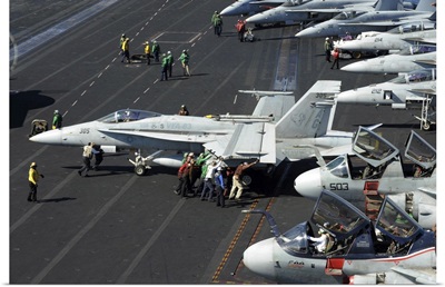 Sailors Push An F/A-18C Hornet In Preparation For Flight Operations