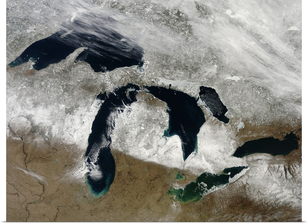 March 28, 2011 - The bright white remnants of snow cut a clean swath across Wisconsin and Michigan during springtime snowm...