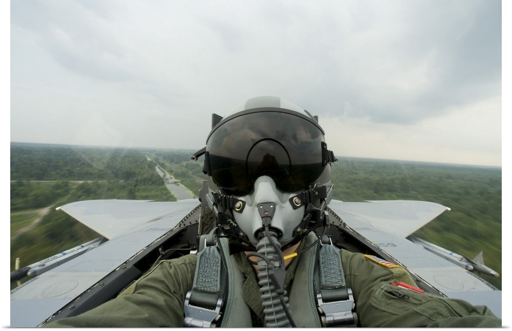 August 27, 2008 - An aerial combat photographer takes a self-portrait during a sortie over New Orleans, Louisiana.