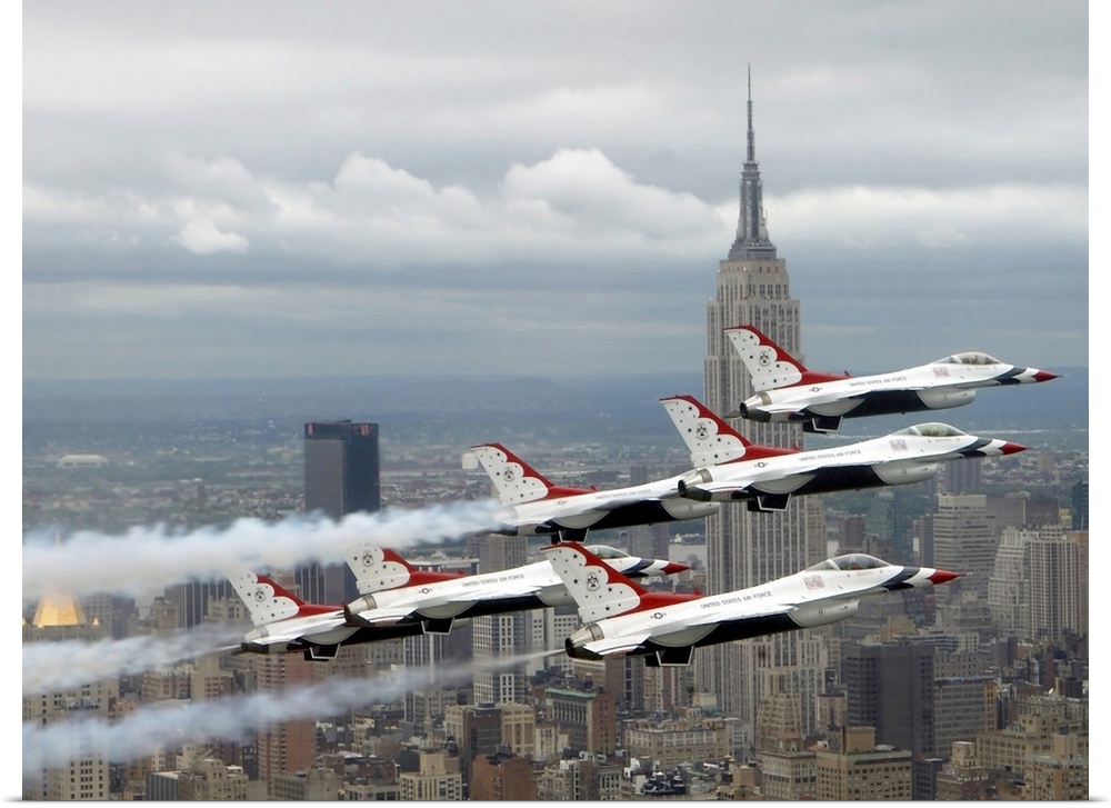 Photo of six US Air Force Thunderbirds flying in V formation high above New York City with the Empire State Building in th...