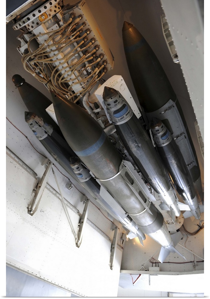 March 31, 2011 - An assortment of 500-pound and 2,000-pound joint direct attack munitions are connected to a multiple ejec...