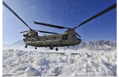 Snow Flies Up As A US Army CH-47 Chinook Helicopter Prepares To Land
