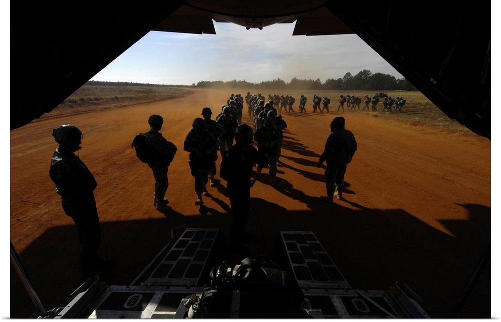 December 6, 2008 - U.S. Army Soldiers board a C-130 Hercules during Operation Toy Drop at Fort Bragg, North Carolina.  The...