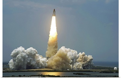 Space Shuttle Atlantis lifts off into the sky