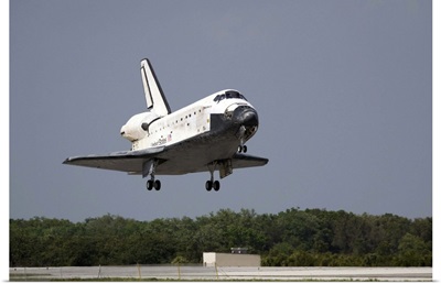 Space Shuttle Discovery approaches landing on the runway at the Kennedy Space Center