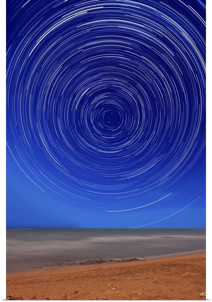 Star trails around the south celestial pole at the beach in Miramar, Argentina. Note the lack of a polar star as there is ...