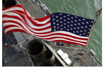 Stars and Stripes flying boldly, seen from the crow's nest aboard USS Donald Cook
