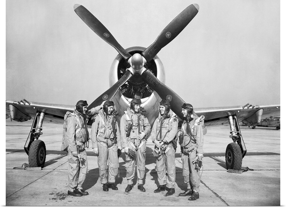 Test pilots stand in front of a P-47 Thunderbolt.