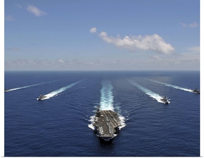 The aircraft carrier USS Abraham Lincoln leading a formation of ships