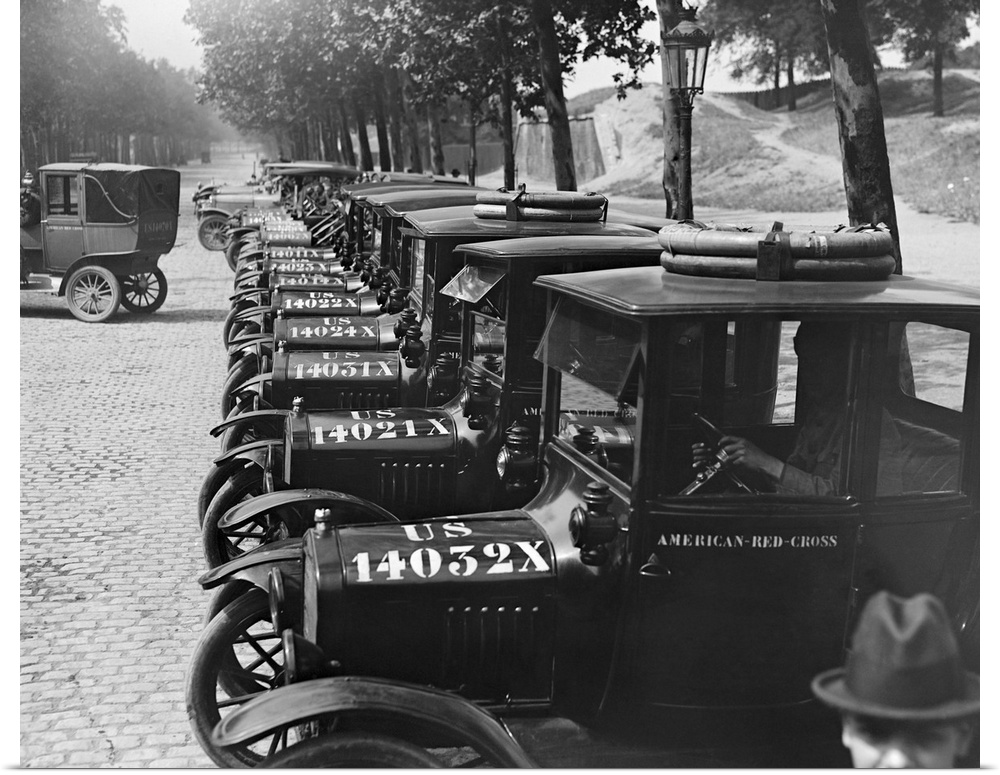 The American Red Cross transportation fleet lined up for inspection, Paris France, 1918.