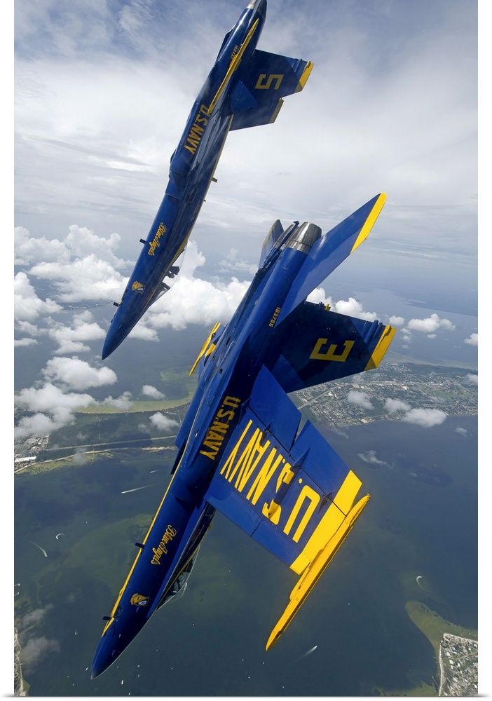 Pensacola, Florida, July 12, 2012 - The U.S. Navy flight demonstration squadron, the Blue Angels, perform a looping maneuv...