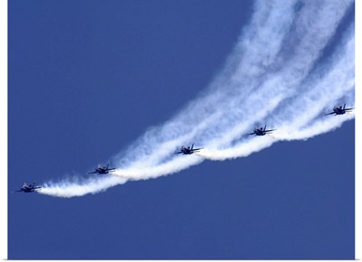 The Blue Angels performing a line abreast loop during an air show