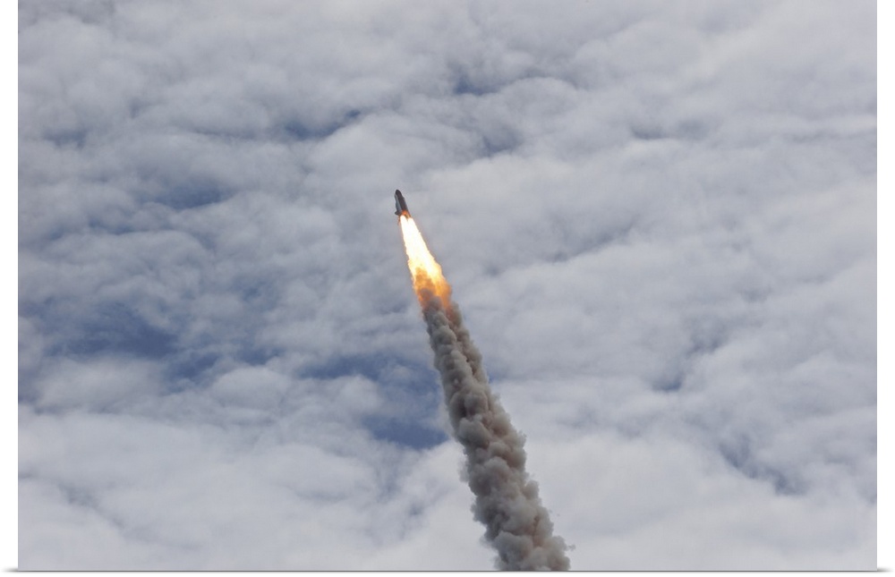 July 8, 2011 - Space shuttle Atlantis just before it disappears into the clouds, Cape Canaveral, Florida.
