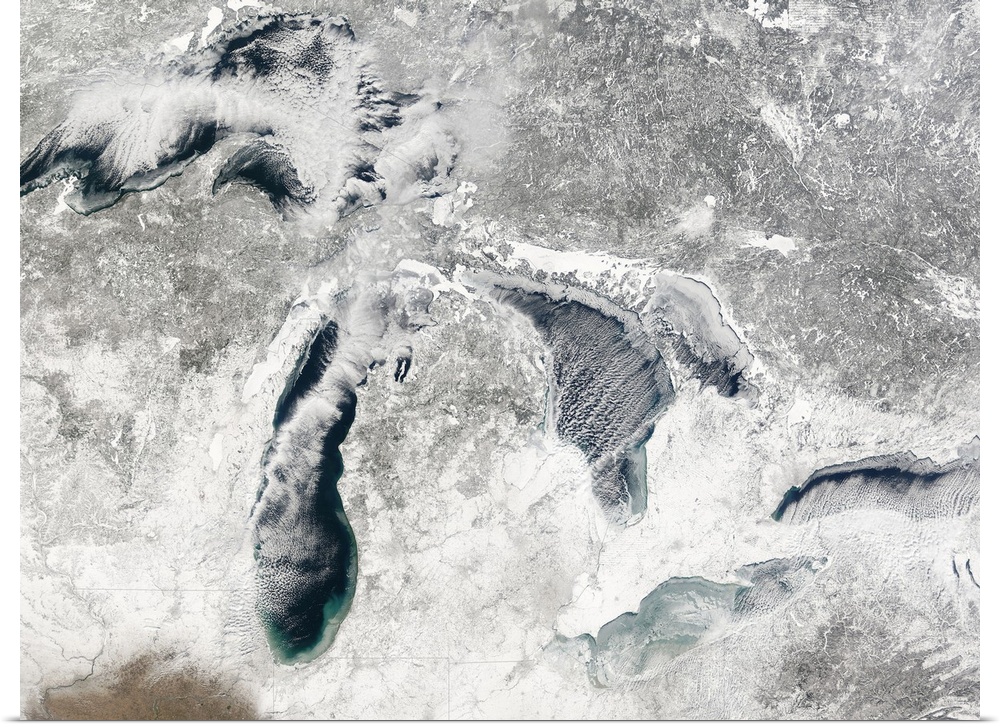 A large aerial view of the great lakes during the winter season and covered in snow.