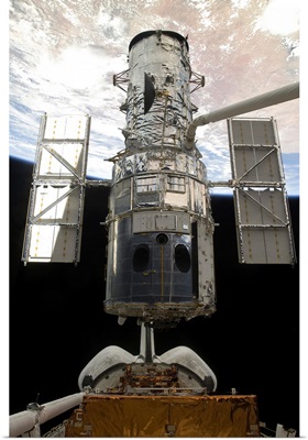 The Hubble Space Telescope is released from the cargo bay of Space Shuttle Atlantis
