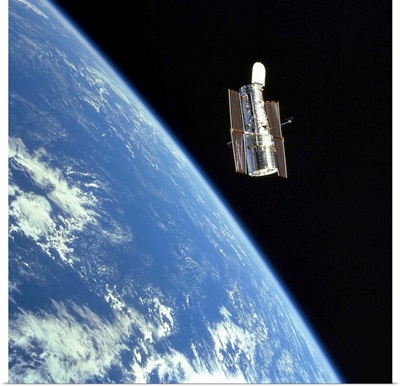 The Hubble Space Telescope with a blue earth in the background