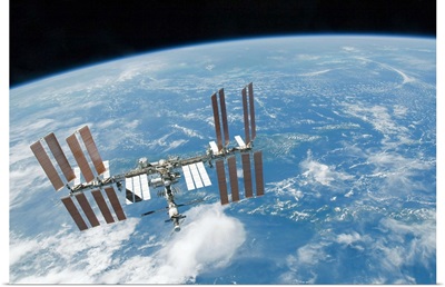The International Space Station backdropped by Earths horizon