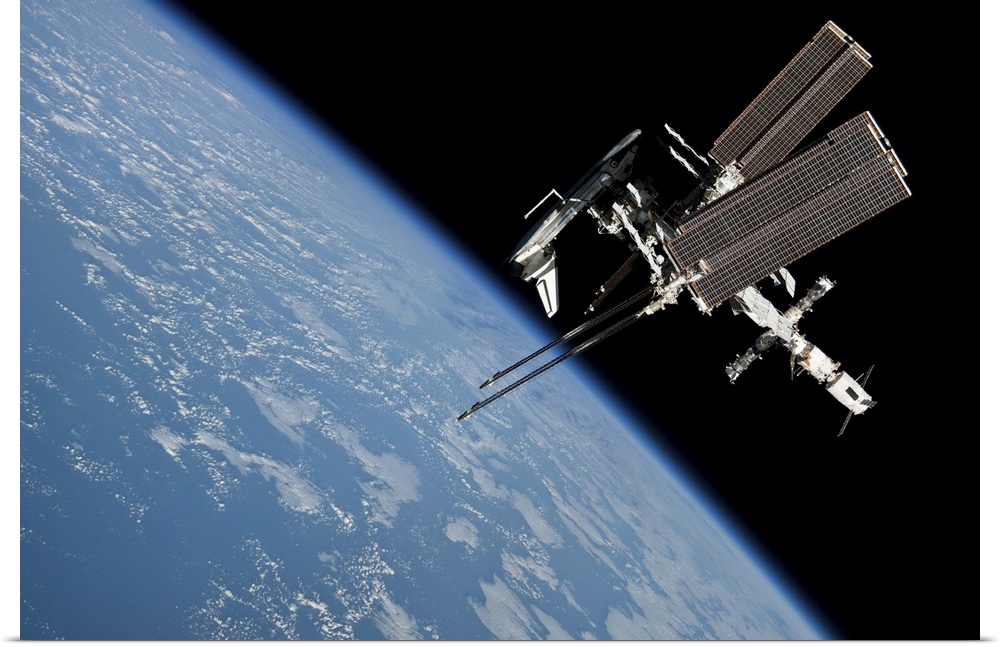 May 23, 2011 - The International Space Station and docked Space Shuttle Endeavour, backdropped by Earth and the blackness ...