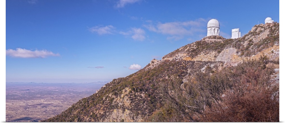 The Mayall Observatory sits atop Kitt Peak, overlooking the city of Tucson, Arizona in the distance.
