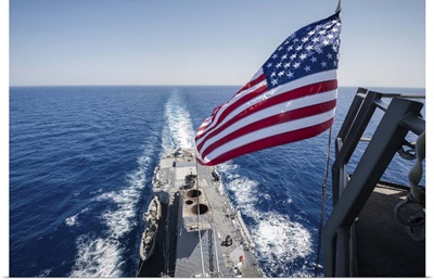 The national ensign flies from the mast aboard USS Stockdale