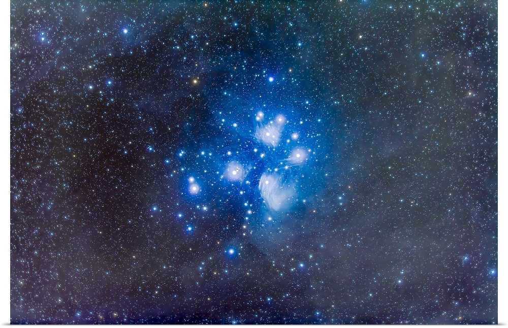 The Pleiades star cluster, or Seven Sisters, aka Messier 45, in Taurus. The brightest part of the reflection nebula around...