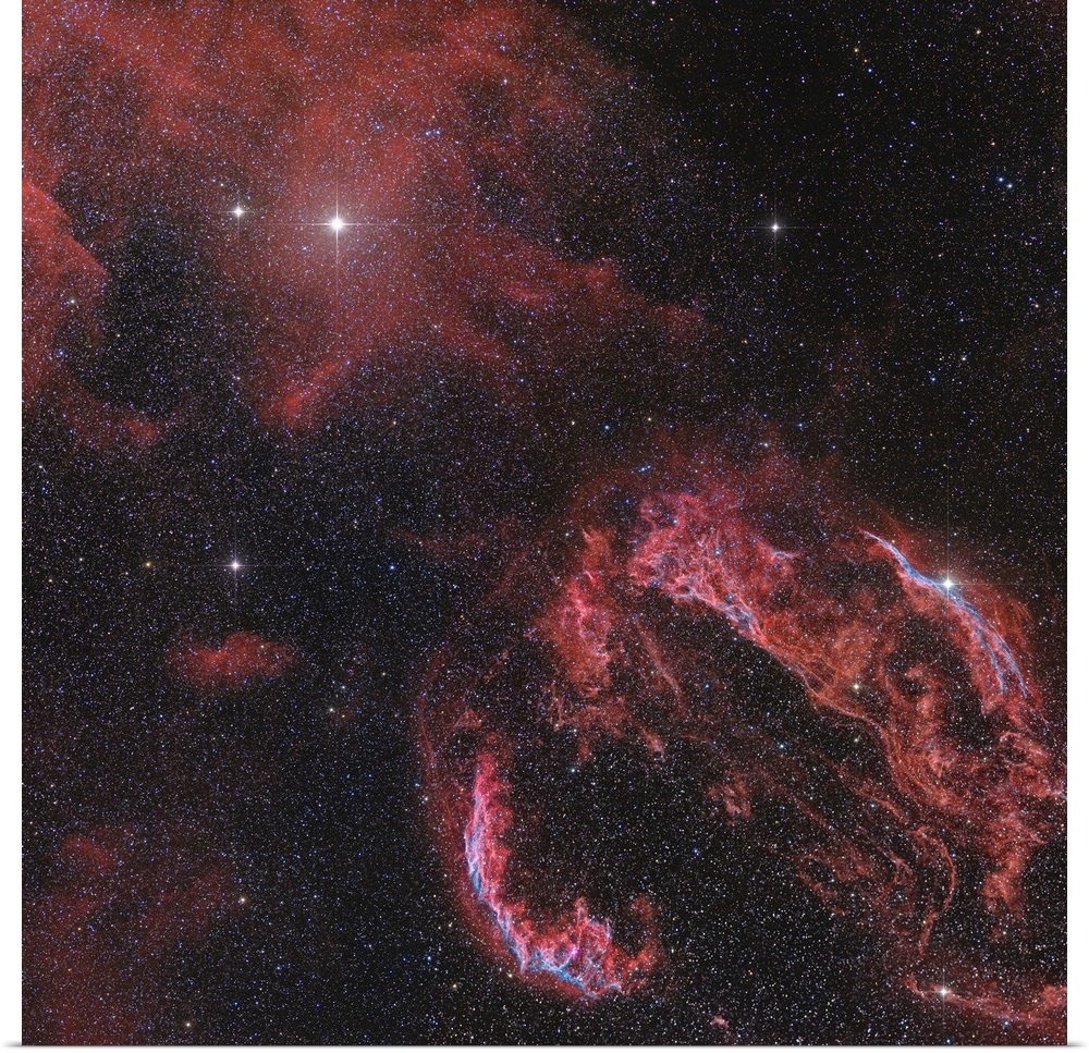 The Veil Nebula in the constellation Cygnus glows red.