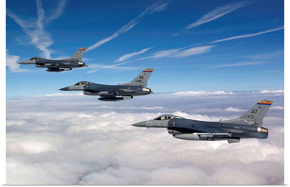 Three F-16's stationed at the 162nd Fighter Wing in Tucson, Arizona, fly in formation during a training mission.