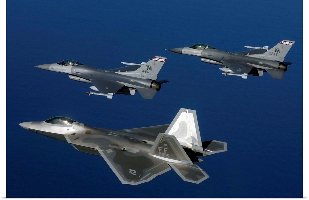 Three F-22A Raptor aircrafts fly in formation.