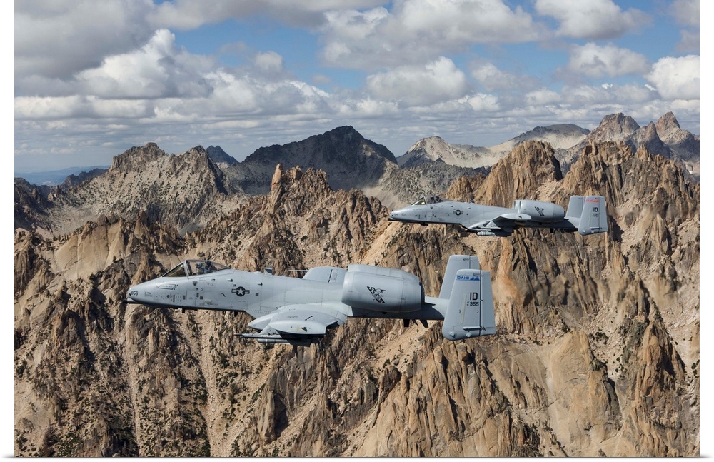 Two A-10 Thunderbolt's from the 124th Fighter Wing's 190th Fighter Squadron fly the jagged peaks of the Sawtooth Mountains...