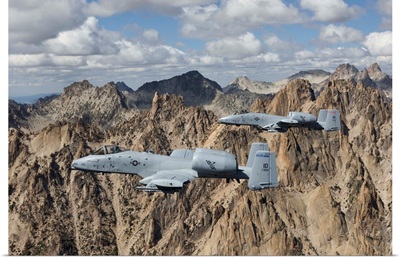 Two A-10 Thunderbolts fly over the mountains in Central Idaho