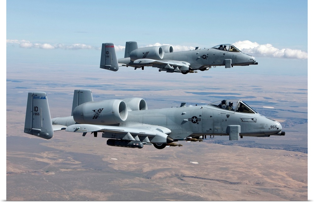 Two A-10 Thunderbolt's from the 124th Fighter Wing fly over the Saylor Creek bombing range in Central Idaho.