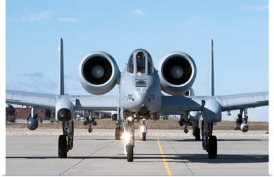 Two A-10 Thunderbolts taxi to the runway