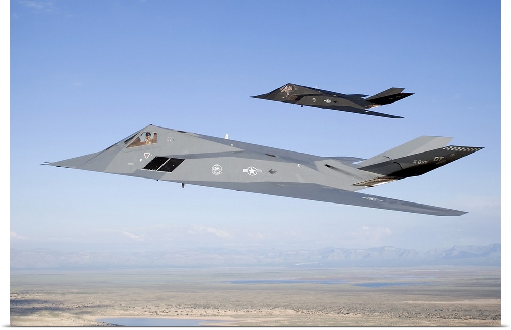 Two F-117 Nighthawk stealth fighters fly on a training sortie out of of Holloman Air Force Base, New Mexico.