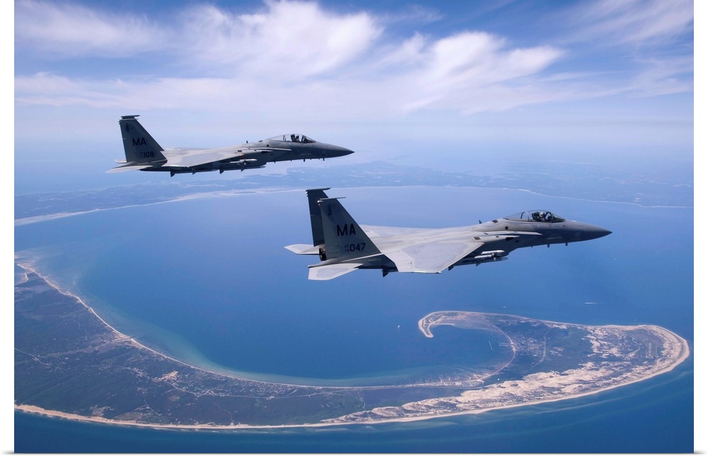 Two F-15 Eagles from the Massachusetts Air National Guard fly high over Cape Cod during a training mission.